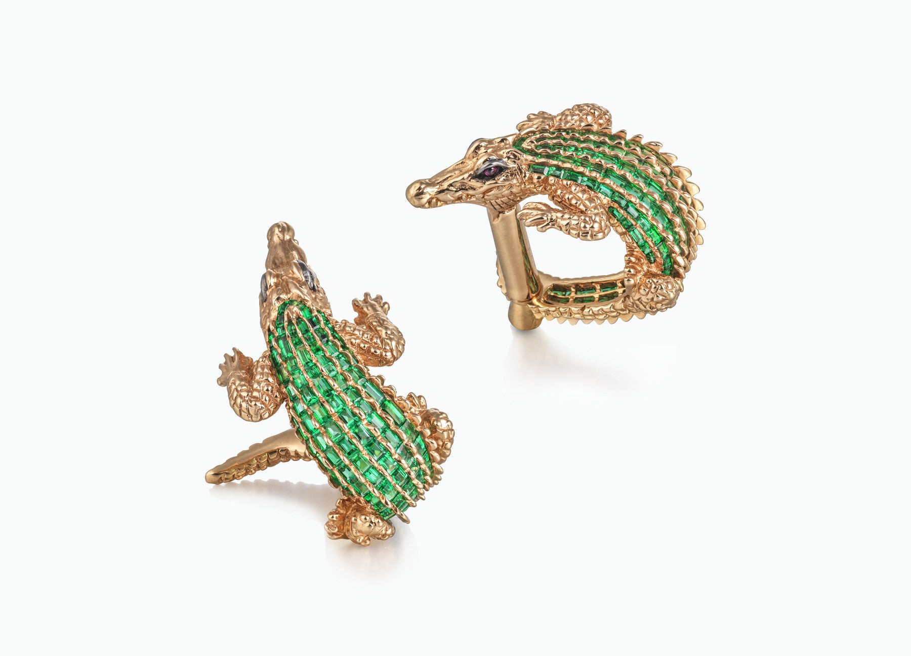 ONE OF A KIND CROCODILE CUFFLINKS IN 18k Yellow gold set with 4 carats of baguette cut emeralds and two rubies