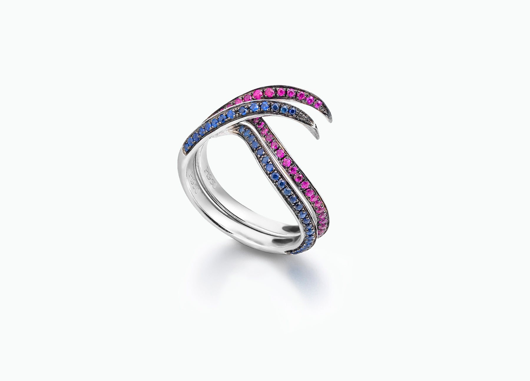 Artistic Twist diamond and sapphire bridal ring set featuring a marquise-cut centre diamond and elegant band rings with precious gemstones