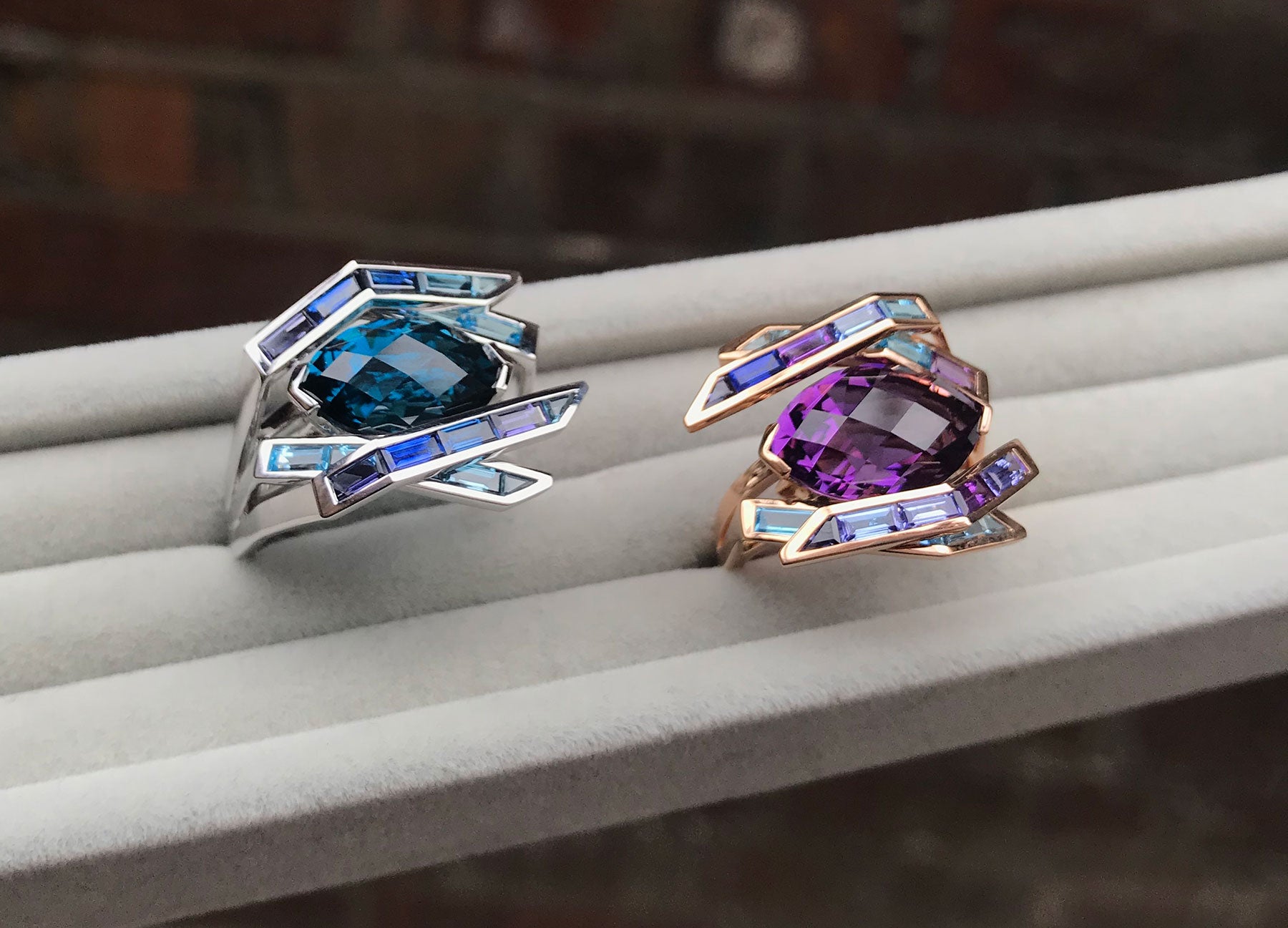 Electric Night Amethyst and Blue Topaz cocktail rings by Tomasz Donocik side by side