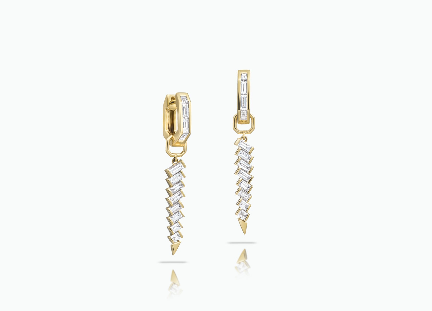 Huggie earrings with detachable Dagger Extensions. Made from rose, yellow or white 18k Gold with baguette-cut GVS white Diamonds.