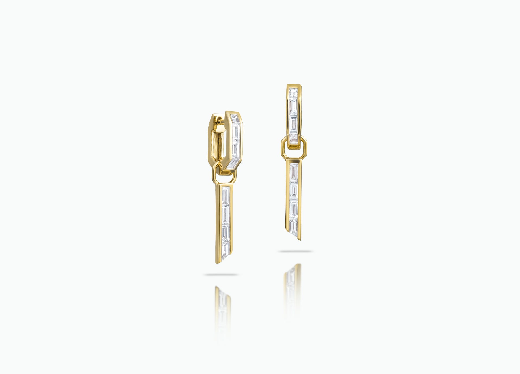 Huggie earrings with detachable Tassle Extensions. Made from rose, yellow or white 18k Gold with baguette-cut GVS white Diamonds.