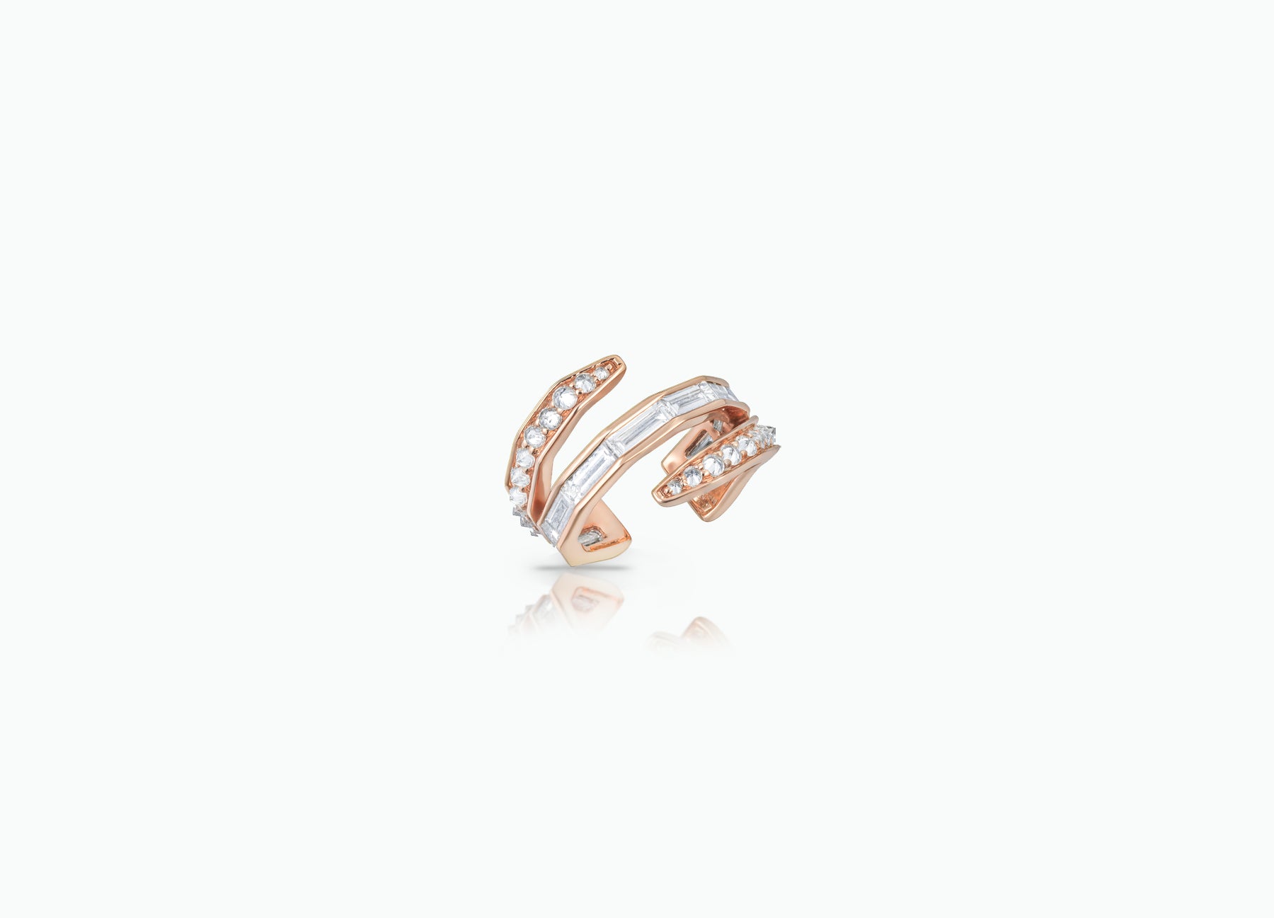 Single Ear Cuff made from rose, yellow or white 18k Gold. Features three rows of baguette-cut and round-cut GVS white Diamonds.