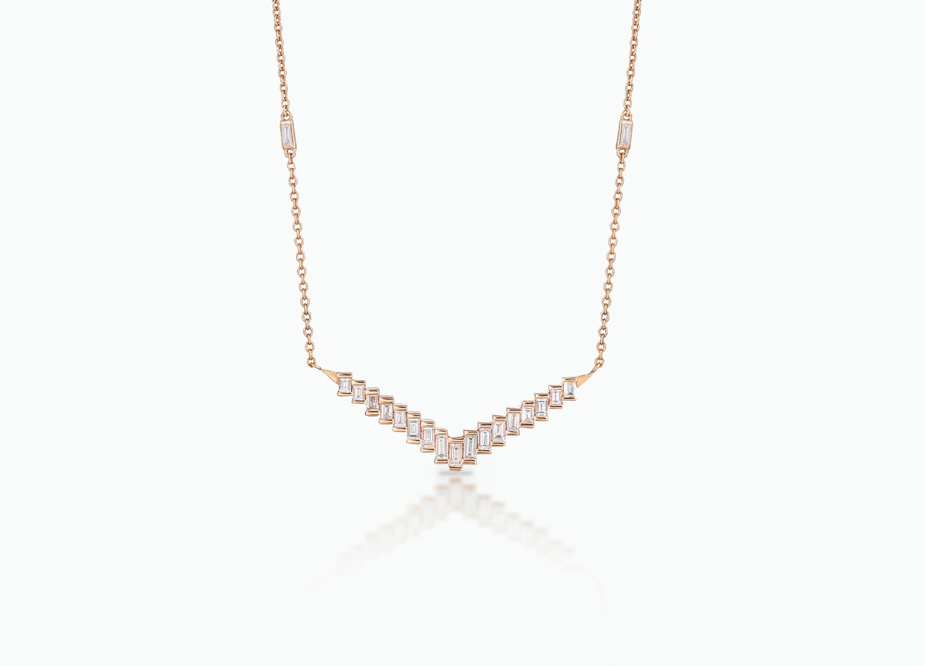 Pendant with baguette white Diamonds that create a chevron pattern. Made from rose, yellow or white 18k Gold.