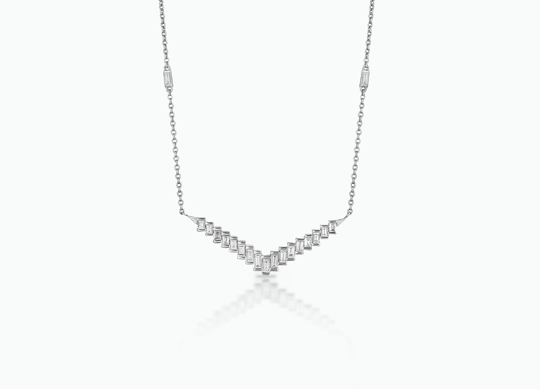 Pendant with baguette white Diamonds that create a chevron pattern. Made from rose, yellow or white 18k Gold.