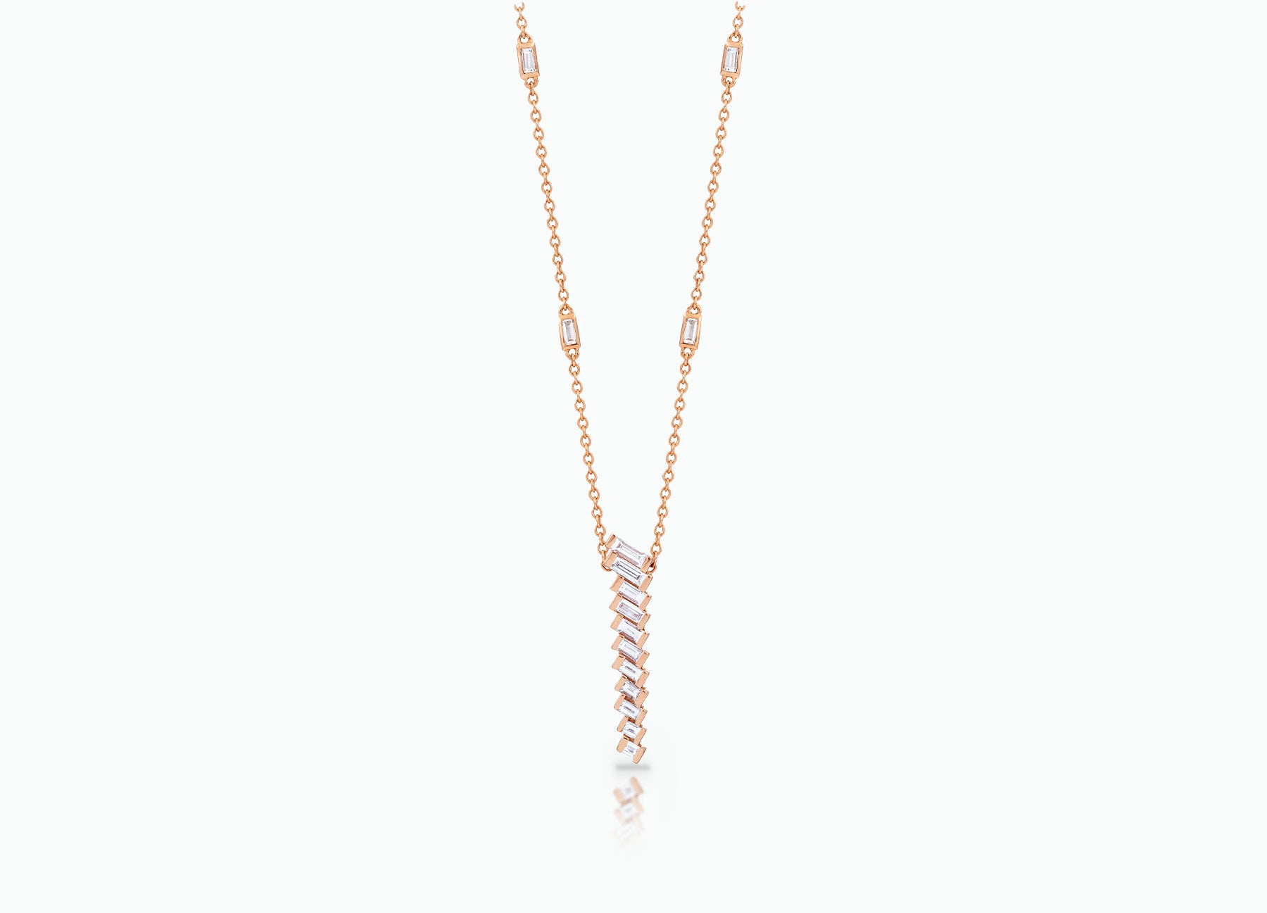 Pendant with baguette white Diamonds that create a chevron pattern. Made from rose, yellow or white 18k Gold.  Total carat weight 0.70ct.