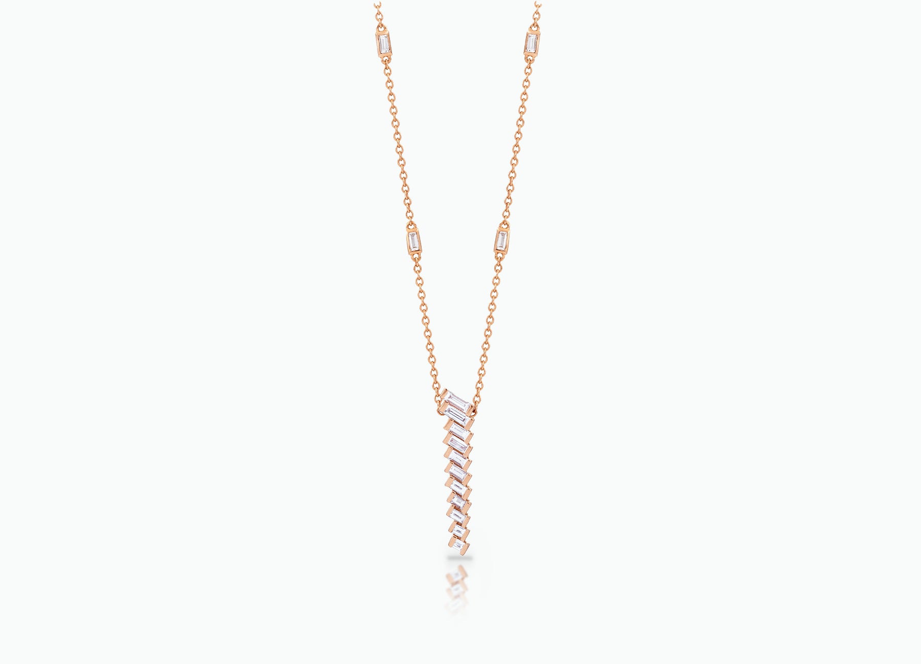 Pendant with baguette white Diamonds that create a chevron pattern. Made from rose, yellow or white 18k Gold.  Total carat weight 0.70ct.