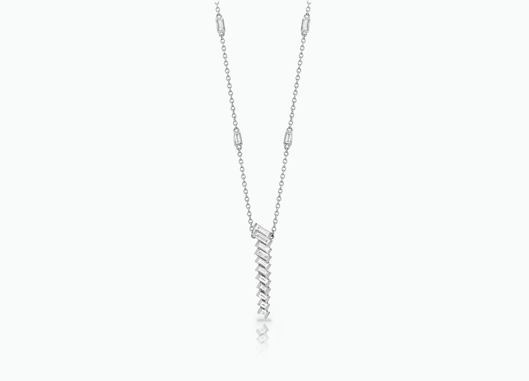Pendant with baguette white Diamonds that create a chevron pattern. Made from rose, yellow or white 18k Gold.