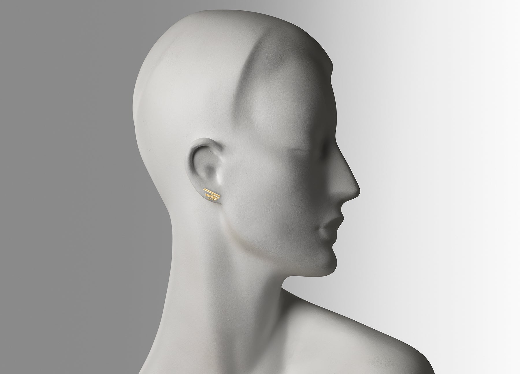 Stellar Stud earrings in 18K yellow gold with white diamonds by Tomasz Donocik worn on mannequin