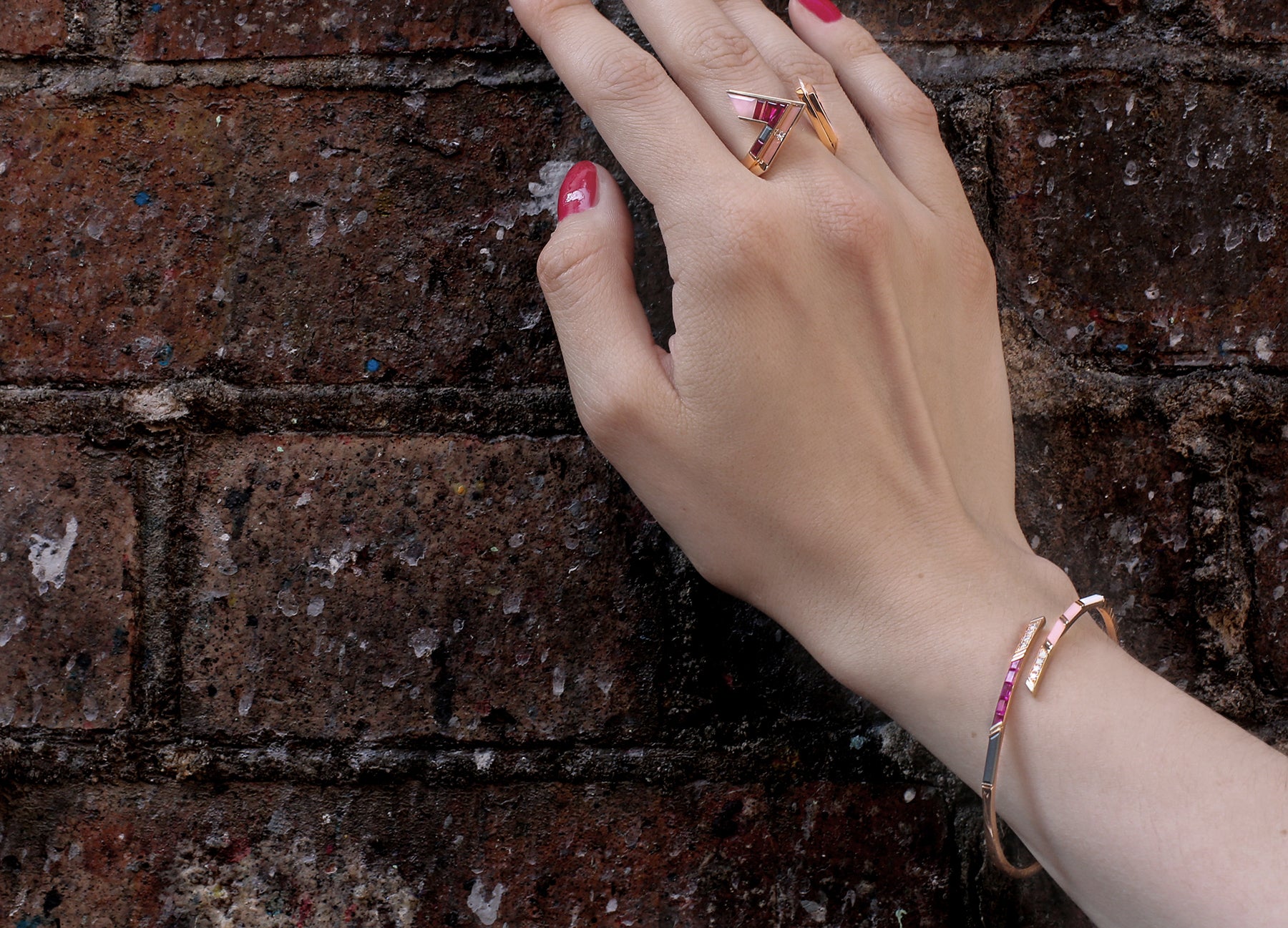 Ruby diamond and pink opal bangle in 18K rose gold by Tomasz Donocik worn view 2