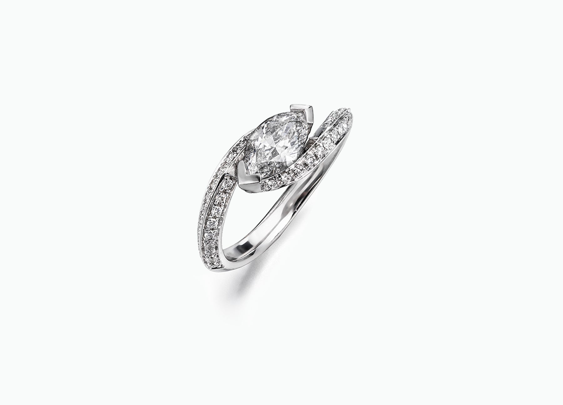 Unique Twist bridal ring set featuring a GIA marquise-cut diamond engagement ring and bands adorned with rubies and blue sapphires