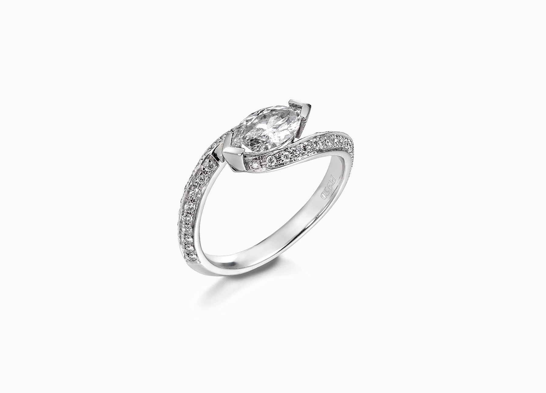 Elegant Twist bridal set showcasing a marquise-cut diamond surrounded by sapphire and ruby-accented bands for a bespoke look