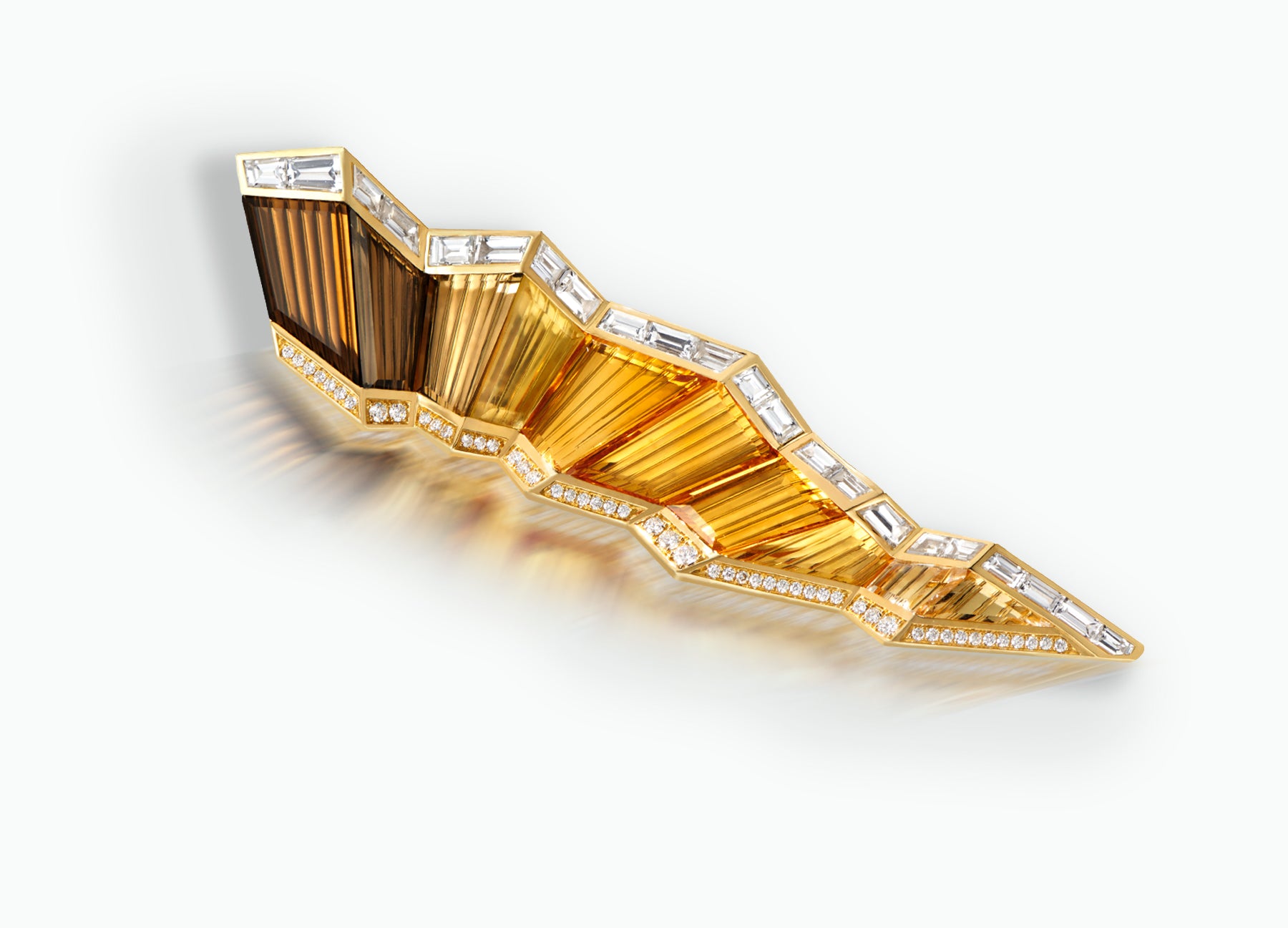 Kaleidoscope Pleat Brooch crafted in 18k yellow Gold and set with smoky Quartz, Citrine, yellow Topaz, clear Crystal, white Sapphires and white Diamonds.