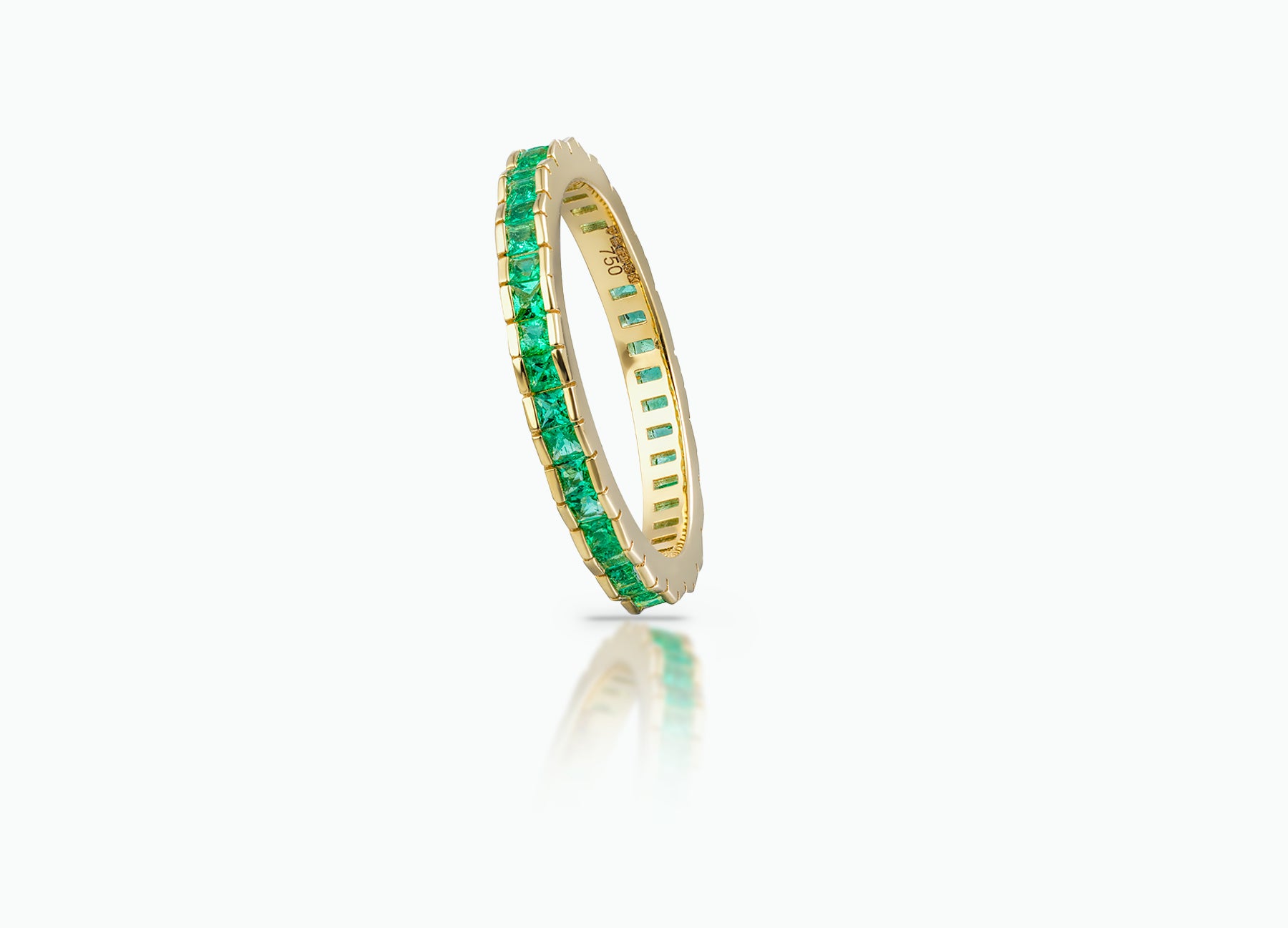 Eternity Stack Ring crafted from 18k yellow Gold and set with Emeralds.