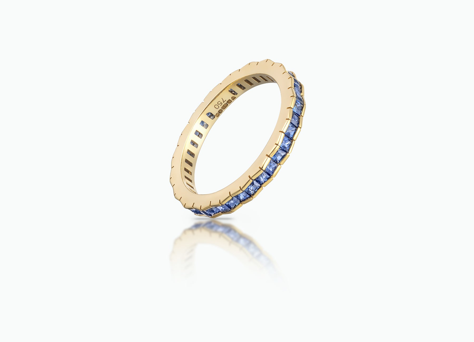 Eternity Stack Ring crafted from 18k yellow Gold and set with blue Sapphires.