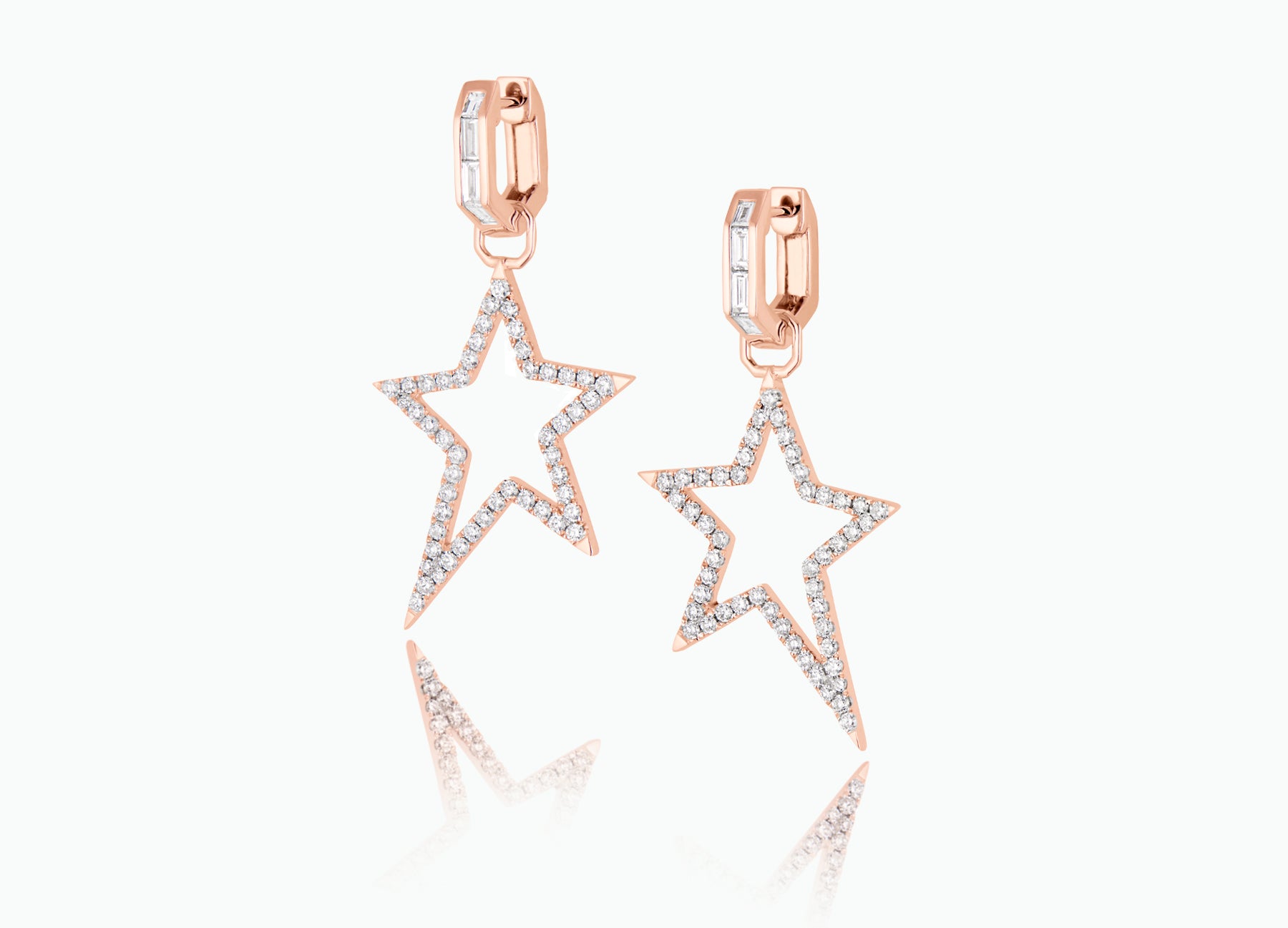 Huggie earrings with detachable Star Extension. Made from white, rose or yellow 18k Gold with round white Diamonds.