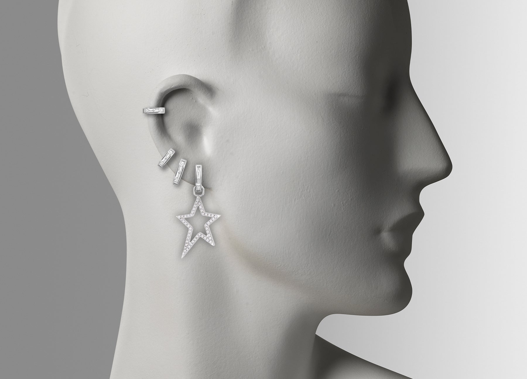Huggie earrings with detachable Star Extension. Made from white 18k Gold with round white Diamonds.